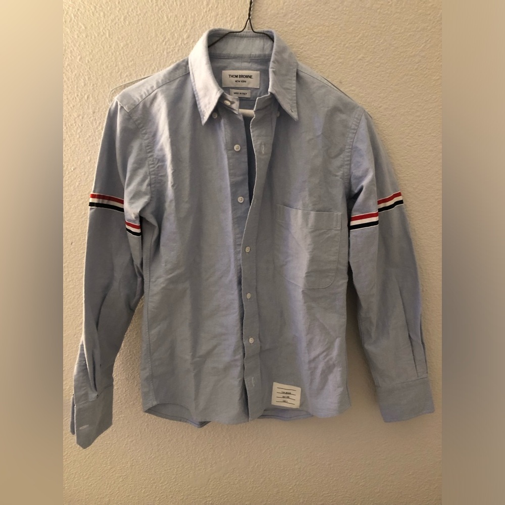 Thom Browne blue shirt.